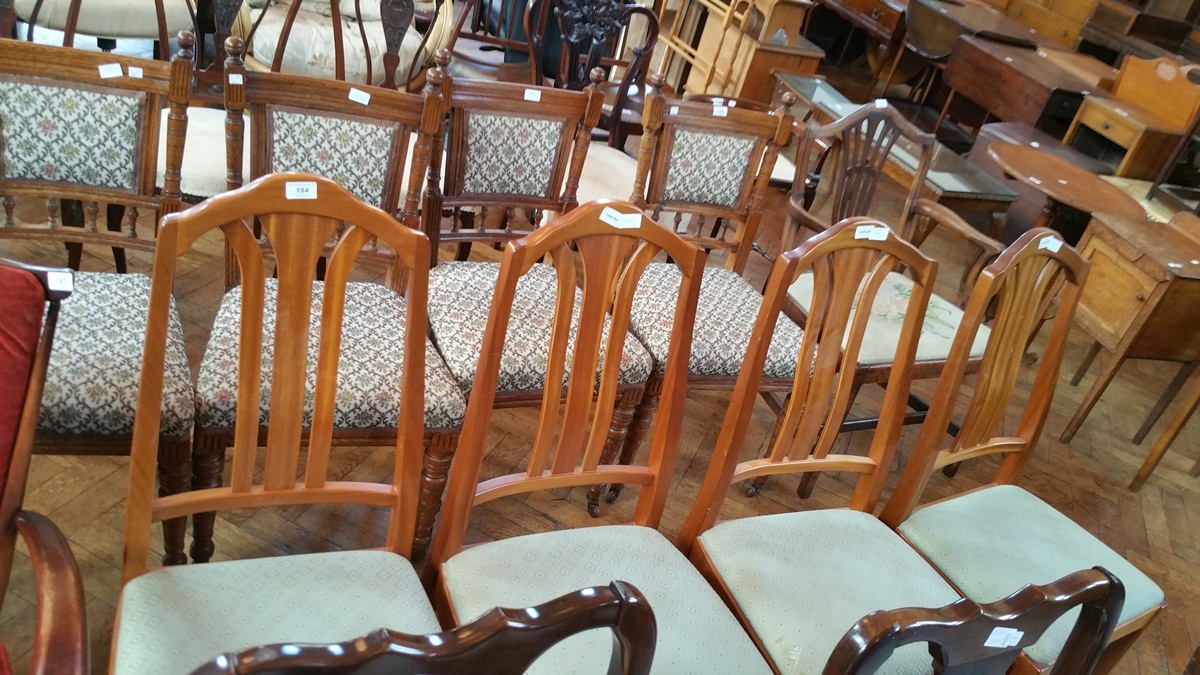 A set of modern light mahogany framed dining chairs