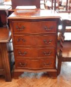 Reproduction mahogany serpentine front chest of four drawers, raised on bracket feet,