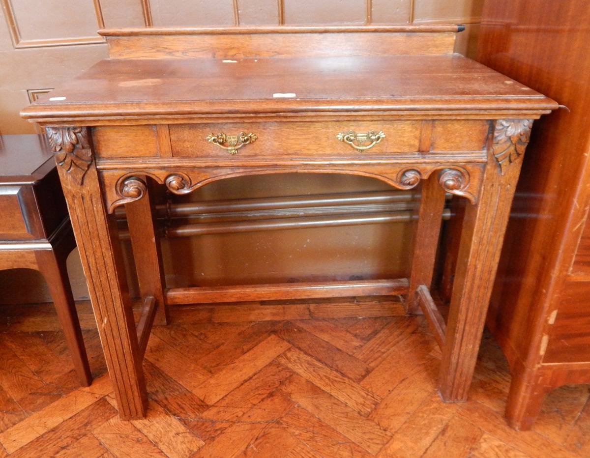 An old oak rectangular topped side table with moulded edge and frieze drawer,