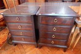 A pair of Stag furniture bedside chests of four long drawers on bracket feet,