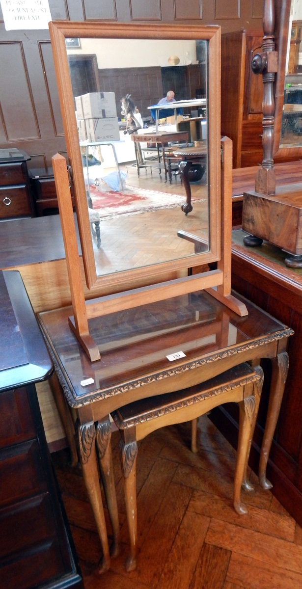 A nest of three occasional tables, with plate glass tops,