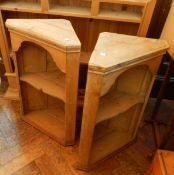 A pine plate rack with two shelves and three small drawers together with a pair of pine corner