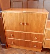 A modern teak/oak mirror back dressing chest of four short drawers,