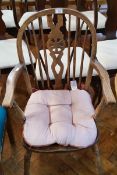 An oak and elm seated wheelback Windsor type kitchen chair