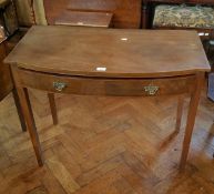 A 19th century mahogany bowfront side table fitted frieze drawer with brass drop handles with