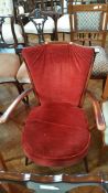 An Ercol style open arm stickback elbow chair