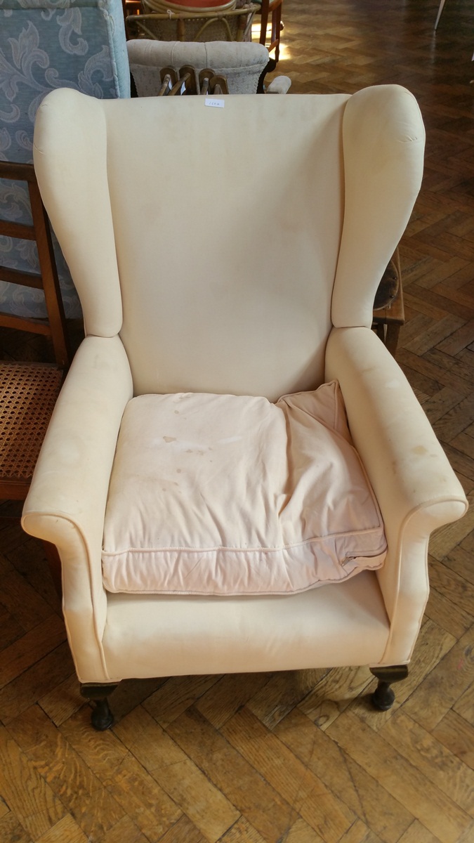 Wing armchair in cream calico,