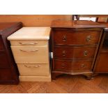 A mahogany serpentine front small chest of three long drawers, raised on bracket feet,