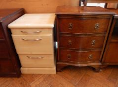 A mahogany serpentine front small chest of three long drawers, raised on bracket feet,