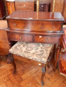 A reproduction mahogany desk, the writing front enclosing a fitted interior with writing surface,