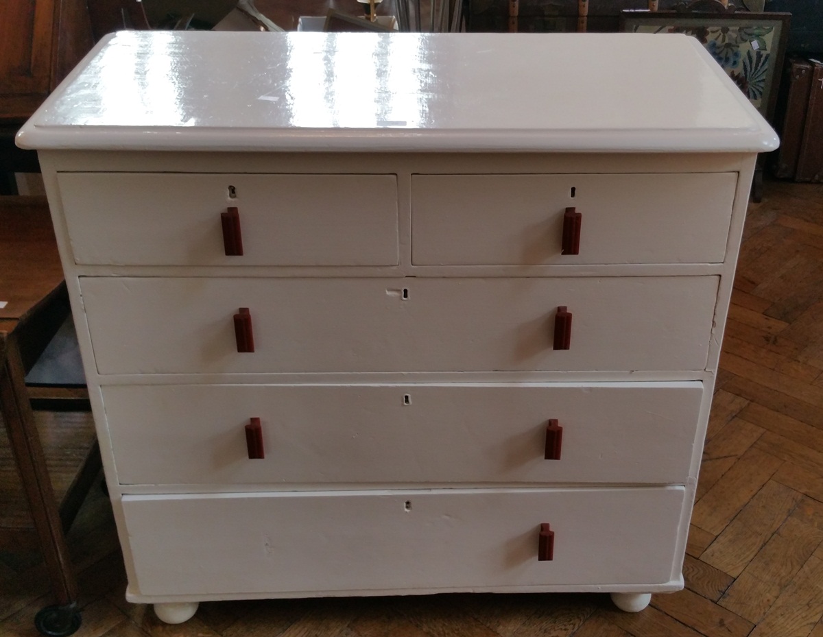 A Victorian white painted pine chest of two short and three long drawers,