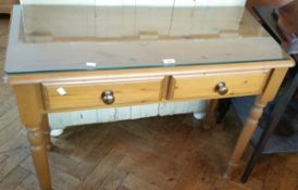 A stained pine side table fitted two frieze drawers,
