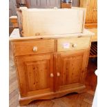 A pine cupboard with two frieze drawers,