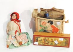 A child's sewing machine, the Little Betty, boxed, a small German doll,