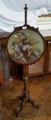 A Victorian mahogany pole screen,