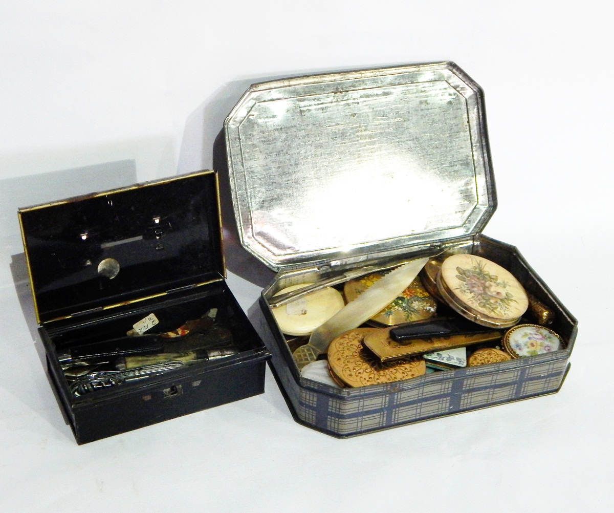 A quantity of compacts and other items and a cash box containing a collection of penknives