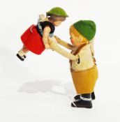 A Schuco clockwork toy of father with daughter