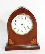 An Edwardian mahogany lancet-style mantel clock with quarter pattera inlaid spandrels