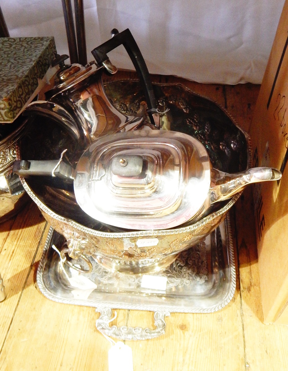 A silver plated punch bowl of circular form with lion mask ring handles, on pedestal foot,