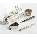 A silver four-division toast rack, a silver box of teardrop shaped form,