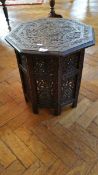 An Eastern carved hardwood octagonal top occasional table,