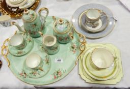 A porcelain early morning tea service of eight pieces viz:- teapot, sugar bowl, cream jug,