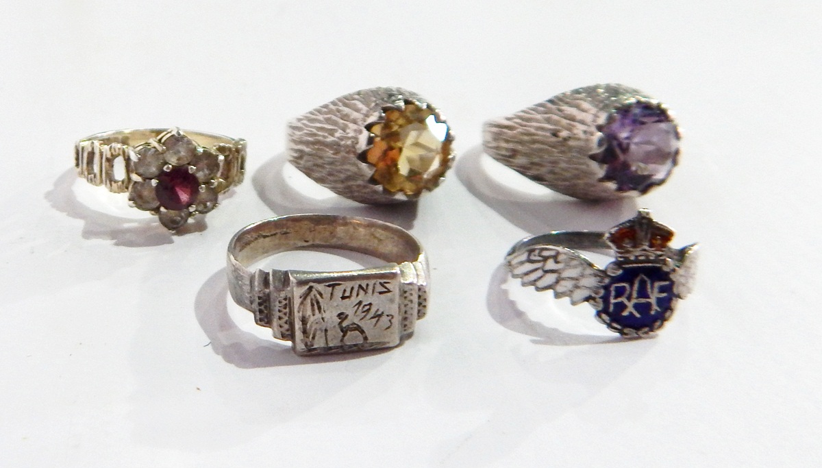 Two modern silver rings of textured design, one set with an amethyst, the other with a citrine,