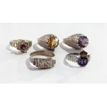 Two modern silver rings of textured design, one set with an amethyst, the other with a citrine,