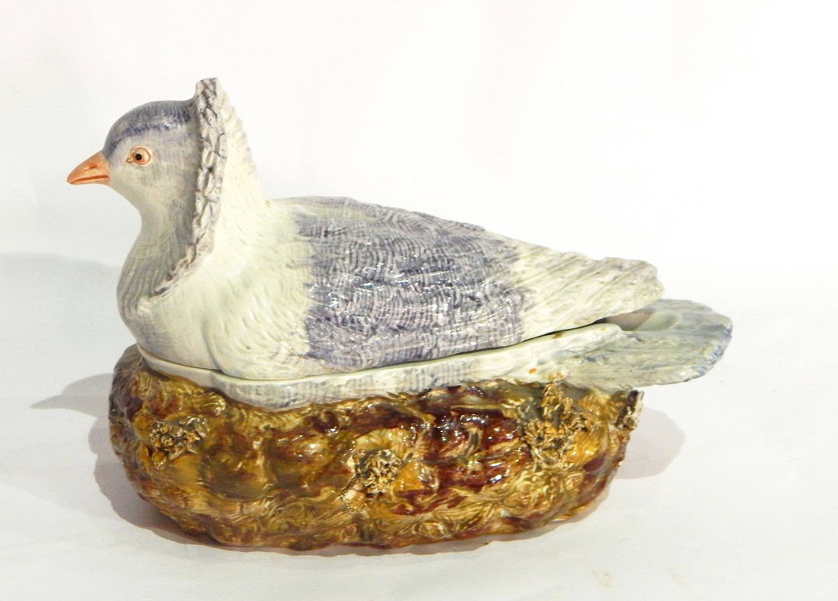 Continental pottery majolica game pie dish in the form of bird seated on nest,