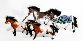 Four dolls horses