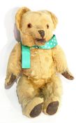 A vintage mohair bear with open mouth mechanism, having button lever at the back,