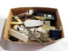 A quantity of silver plate including an embossed tankard and a large amount of cutlery