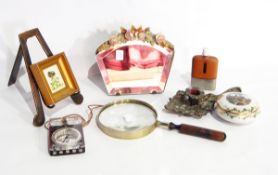 A desk magnifying glass, a dressing table mirror with floral decoration,