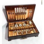 A canteen of cutlery in walnut case and a set of plated teaspoons