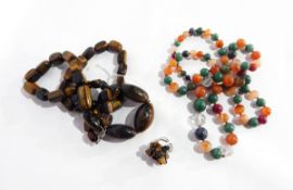 A tiger's eye bead necklace comprising of graduated oval and rectangular beads and a second