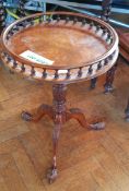 A Georgian style mahogany circular top occasional table, the open gallery with spindle supports,