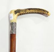 A malacca walking stick with engraved silver collar and antler handle