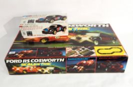 The Scalextric's Ford RS Cosworth set to include cars and track, boxed,