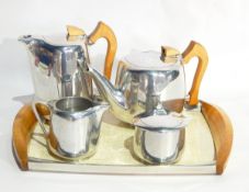 A picquotware teaset comprising formica and wooden tray, teapot, hot water jug,