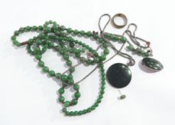 A pair of jade bead pendant earrings, two strings of jade-coloured beads,