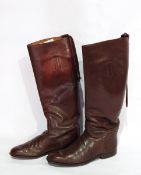 A pair of leather riding boots, a malacca writing crop with silver collar and antler handle,