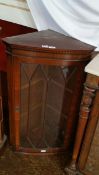 Georgian style mahogany bowfront corner cupboard, with dentil cornice,