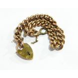 A 9ct gold curb link bracelet with padlock clasp, approximately 13.