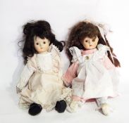 Two 20th century bisque head dolls with soft bodies,