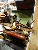 A tin box and contents including an Underwood & Underwood stereoscopic viewer, a retro telephone,