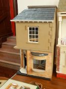 A doll's house with bay window, entrance hall, removable roof, electric points,