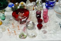 A ruby glass bowl, three flower vases, red sherry glasses, three paperweights, etc.