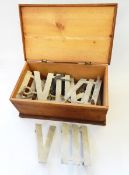 A pine box containing metal clock golf numerals