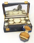 A blue leather dressing case with fitted interior,