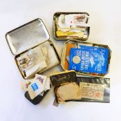 A collection of stamps in tin boxes